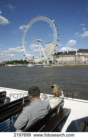 Stock Photo - United Kingdom, England, Millennium Wheel Viewed From Thames Cruise Boat; London. Fotosearch