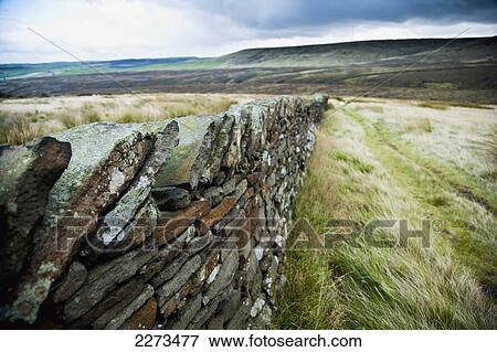 Stock Photo - United Kingdom, England, near Holmfirth and Digley Reservoir; Yorkshire, Dry Stone wall and moorland Yorkshire Moors. Fotosearch