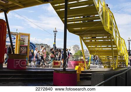 Stock Image - United Kingdom, England, People on South Bank; London. Fotosearch