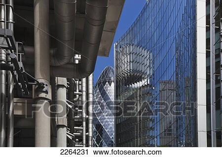 Stock Image - United Kingdom, England, Sir Norman Foster Building behind Willis and Lloyd Buildings; London. Fotosearch