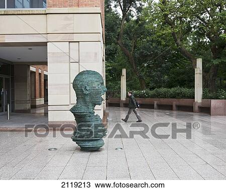 Stock Image - United Kingdom, Northern Ireland, Eco sculpture by Mark Didou outside Queens University Library; Belfast. Fotosearch
