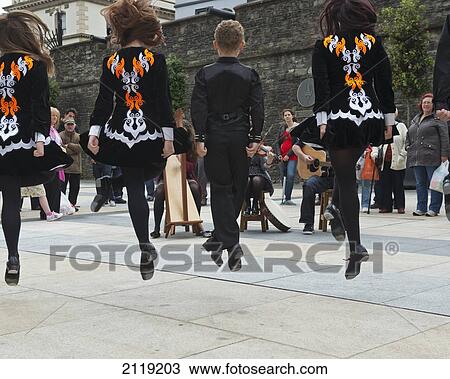 United Kingdom, Northern Ireland, County Londonderry, Irish dancers and musicians playing at Guildhall Square; Derry View Large Photo Image Stock Image - United Kingdom, Northern Ireland, County Londonderry, Irish dancers and musicians playing at Guildhall Square; Derry. Fotosearch