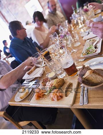 Stock Image - United Kingdom, Northern Ireland, Belfast, Dinner at Nicks Warehouse; Hill St. Fotosearch