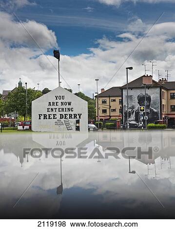 United Kingdom, Northern Ireland, County Londonderry, Reflected view of murals in Bogside Area; Derry View Large Photo Image Stock Photo - United Kingdom, Northern Ireland, County Londonderry, Reflected view of murals in Bogside Area; Derry. Fotosearch