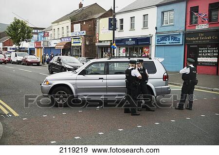 Stock Photo - United Kingdom, Northern Ireland, Police roadblock in loyalist sector of city; Belfast. Fotosearch