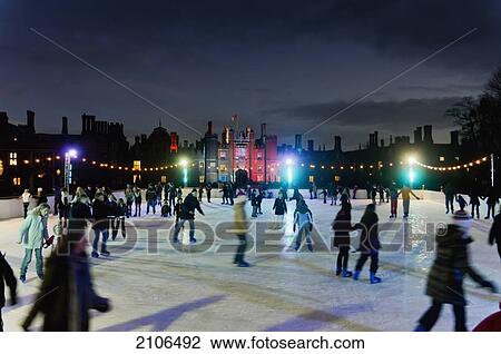 Stock Image - United Kingdom, People on ice skating pool in Hampton Court; London. Fotosearch