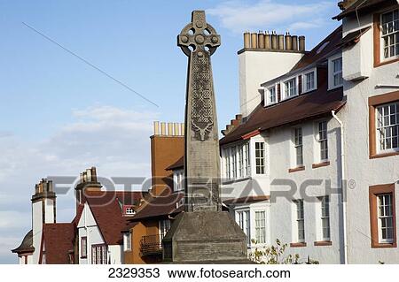 Stock Image - United Kingdom, Scotland, Celtic Cross dominating in residential district; Edinburgh. Fotosearch