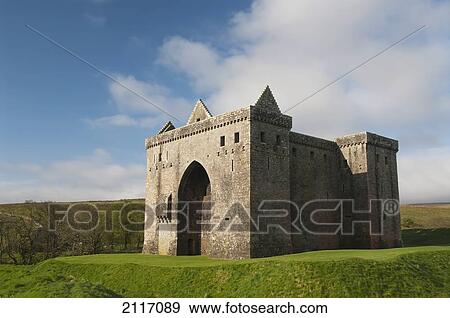 Stock Photo - United Kingdom, Scotland, Hermitage Castle near Newcastleton is only semi-ruined and open to the public during summer.. Fotosearch
