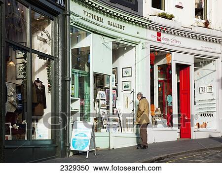 United Kingdom, Scotland, Man looking at window display on West Bow Street; Edinburgh View Large Photo Image Stock Image - United Kingdom, Scotland, Man looking at window display on West Bow Street; Edinburgh. Fotosearch