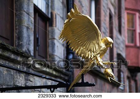 Stock Image - United Kingdom, Scotland, Statue of hunting golden hawk; Edinburgh. Fotosearch