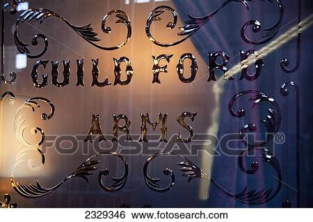 Stock Photograph - United Kingdom, Scotland, View of commercial sign on window; Edinburgh. Fotosearch