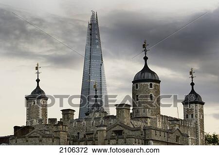 Stock Image - United Kingdom, Shard building in background; London, View of Tower of London. Fotosearch
