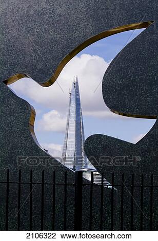 Stock Image - United Kingdom, The Shard of glass seen through bird shape hole; London. Fotosearch