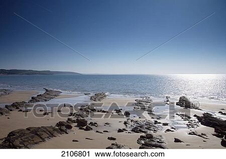 Stock Image - United Kingdom, View of sea and beach; Wales. Fotosearch