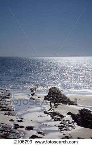 Stock Photo - United Kingdom, View of sea and beach; Wales. Fotosearch