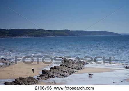 Stock Photograph - United Kingdom, View of sea and beach; Wales. Fotosearch