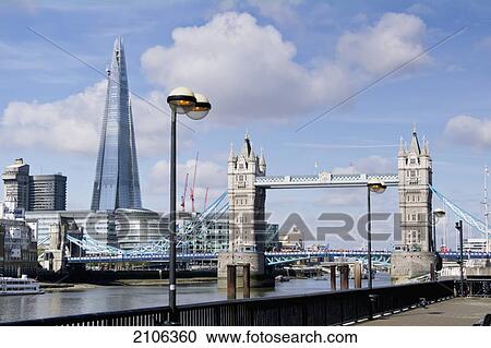 Stock Image - United Kingdom, View of Tower Bridge and Sahrd building; London. Fotosearch