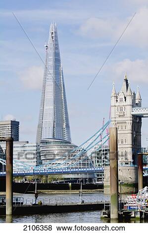 Stock Photo - United Kingdom, View of Tower Bridge and Sahrd building; London. Fotosearch