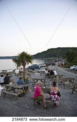 Stock Image - United Kingdom, Wales, Pembrokeshire, Wiseman Arms; Wiseman, People At Picnic Tables. Fotosearch