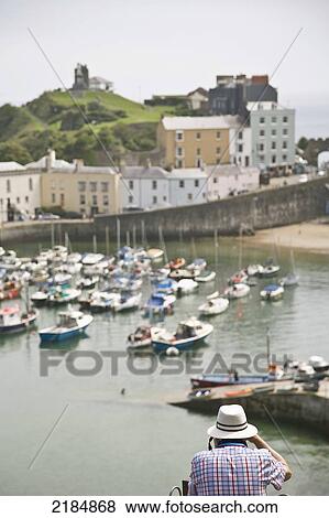 United Kingdom, Wales, Pembrokeshire, Man Photographing Marina; Saundersfoot View Large Photo Image Stock Photo - United Kingdom, Wales, Pembrokeshire, Man Photographing Marina; Saundersfoot. Fotosearch