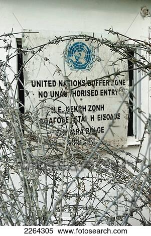 United nations buffer zone no entry sign behind coils of barbed wire; nicosia cyprus View Large Photo Image Stock Photography - United nations buffer zone no entry sign behind coils of barbed wire; nicosia cyprus. Fotosearch