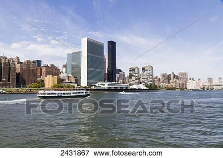 Stock Photo - United Nations Building, as seen from the East River, New York City, New York, United States. Fotosearch