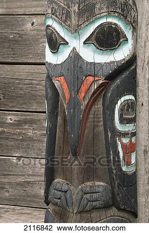 Stock Image - United States, Alaska, Haines, Fort William Seward, Raven's Fort Tribal House, Tlingit Totem Pole. Fotosearch