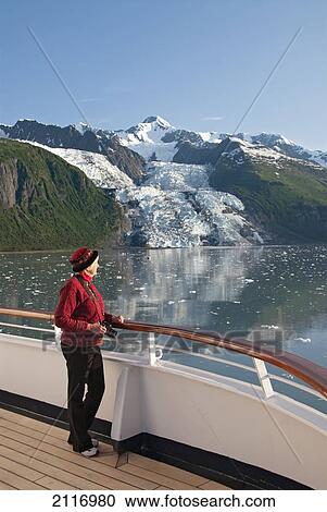 Stock Image - United States, Alaska, Inside Passage, College Fjord, Vasser Glacier, tourist on cruise ship has a view of the glacier. Fotosearch