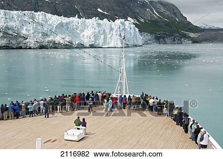 Stock Image - United States, Alaska, Inside Passage, Glacier Bay National Park, passengers on cruise ship viewing the glaciers.. Fotosearch