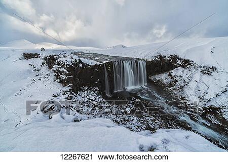 Stock Image - Unnamed waterfall and river in the highlands of Iceland; Iceland. Fotosearch