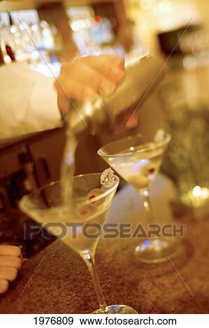 USA, Bartender Mixing Fresh Martinis For Guests; Hawaii View Large Photo Image Stock Photo - USA, Bartender Mixing Fresh Martinis For Guests; Hawaii. Fotosearch