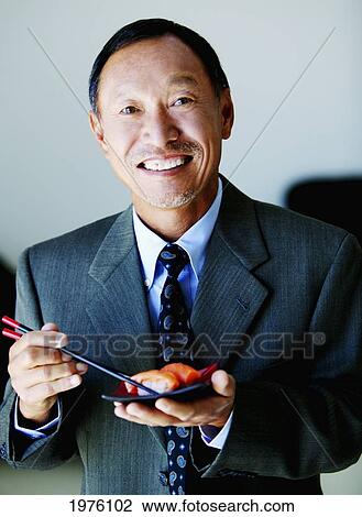 USA, California, Business Man Eating Sushi; Santa Barbara View Large Photo Image Stock Image - USA, California, Business Man Eating Sushi; Santa Barbara. Fotosearch