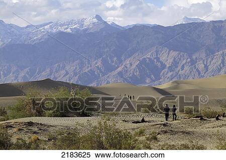Stock Photography - Usa, California, Mesquite Flat Sand Dunes With Amargosa Range Mountains In Background; Death Valley National Park. Fotosearch