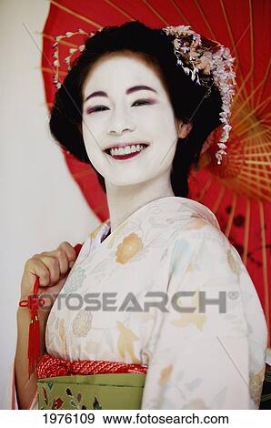 USA, California, Portrait Of Maiko Holding Umbrella; Santa Barbara View Large Photo Image Stock Photo - USA, California, Portrait Of Maiko Holding Umbrella; Santa Barbara. Fotosearch