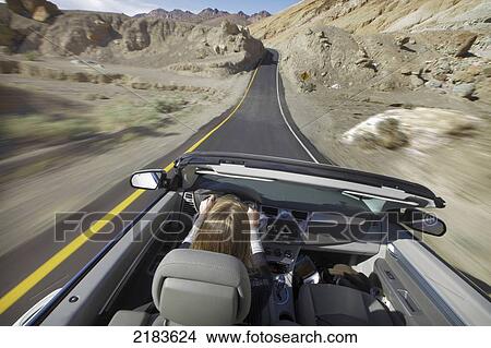 Usa, California, Young Woman Driving Convertible Car; Death Valley National Park View Large Photo Image Picture - Usa, California, Young Woman Driving Convertible Car; Death Valley National Park. Fotosearch