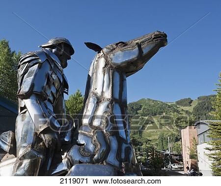 Stock Image - USA, Colorado, Downtown; Aspen, Man on horse sculpture, Public art, Equestrian statue. Fotosearch