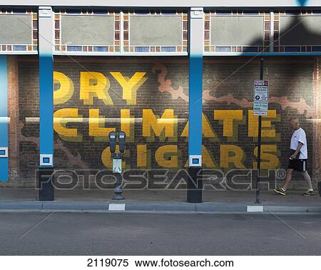 Stock Photography - USA, Colorado, Downtown shopping district; Aspen, Cigar mural. Fotosearch