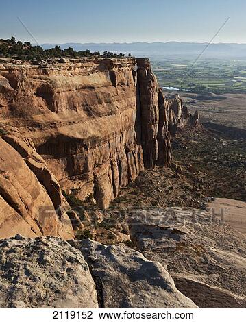 Stock Image - USA, Colorado, Magnificent views of sheer rock canyons and red sandstone monoliths; Colorado National Monument. Fotosearch
