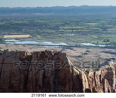 Stock Image - USA, Colorado, Magnificent views of sheer rock canyons and red sandstone monoliths; Colorado National Monument. Fotosearch