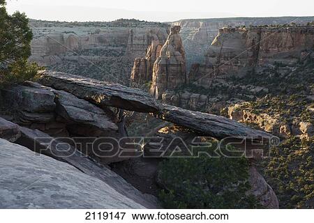 Stock Photo - USA, Colorado, Magnificent views of sheer rock canyons and red sandstone monoliths; Colorado National Monument. Fotosearch