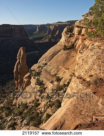 Stock Photo - USA, Colorado, Magnificent views of sheer rock canyons and red sandstone monoliths; Colorado National Monument. Fotosearch