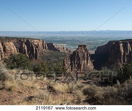 Stock Photo - USA, Colorado, Magnificent views of sheer rock canyons and red sandstone monoliths; Colorado National Monument. Fotosearch