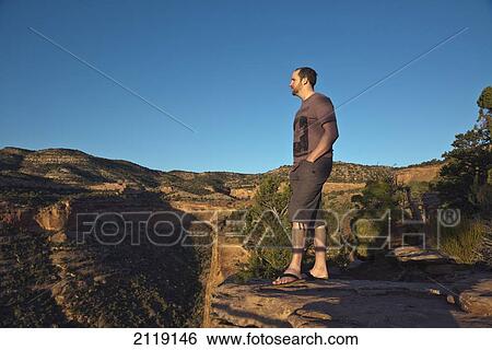 Stock Photograph - USA, Colorado, Magnificent views of sheer rock canyons and red sandstone monoliths; Colorado National Monument. Fotosearch