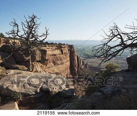 Stock Photography - USA, Colorado, Magnificent views of sheer rock canyons and red sandstone monoliths; Colorado National Monument. Fotosearch