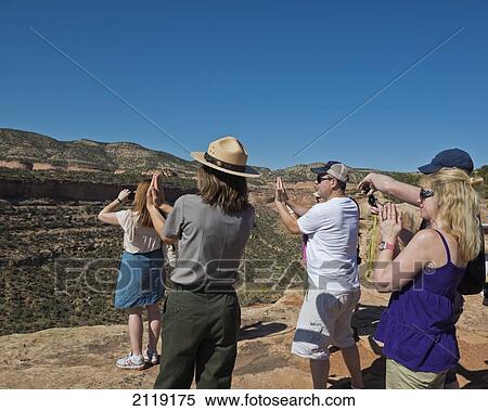 USA, Colorado, National Park Service Ranger with tourists; Colorado National Monument View Large Photo Image Stock Photography - USA, Colorado, National Park Service Ranger with tourists; Colorado National Monument. Fotosearch