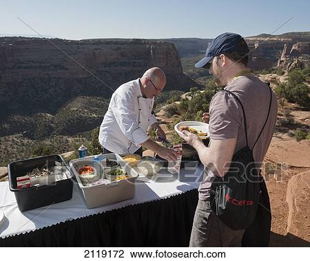 Stock Image - USA, Colorado, Outdoor breakfast served at Bookcliff picnic area; Colorado National Monument. Fotosearch