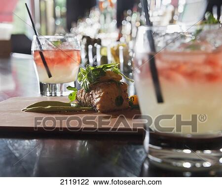 Stock Image - USA, Colorado, Serving of seared Scottish Salmon at Le Grand Bistro; Denver. Fotosearch