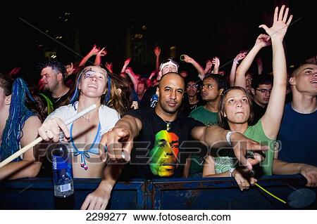 USA., Florida, Downtown; Miami, dancing at Ultra Music Festival, Excited young people wearing brightly colored clothes View Large Photo Image Stock Photo - USA., Florida, Downtown; Miami, dancing at Ultra Music Festival, Excited young people wearing brightly colored clothes. Fotosearch