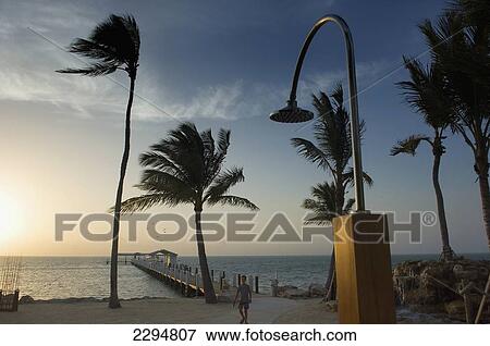 Stock Photo - USA, Florida, Florida Keys, Sunrise over pier and boat dock at luxurious Cheeca Lodge; Islamorada. Fotosearch