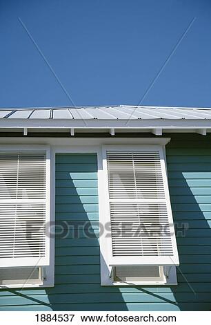 USA, Florida, Pastel Blue Building Exterior With White Shutters; Seaside View Large Photo Image Stock Photo - USA, Florida, Pastel Blue Building Exterior With White Shutters; Seaside. Fotosearch